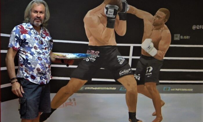 Boş bulduğu duvara resim yapıyor