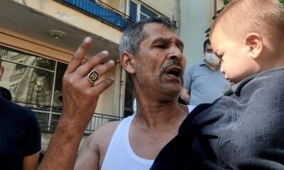 Yangında mahsur kalan çocuğu balkona tırmanıp kurtardılar